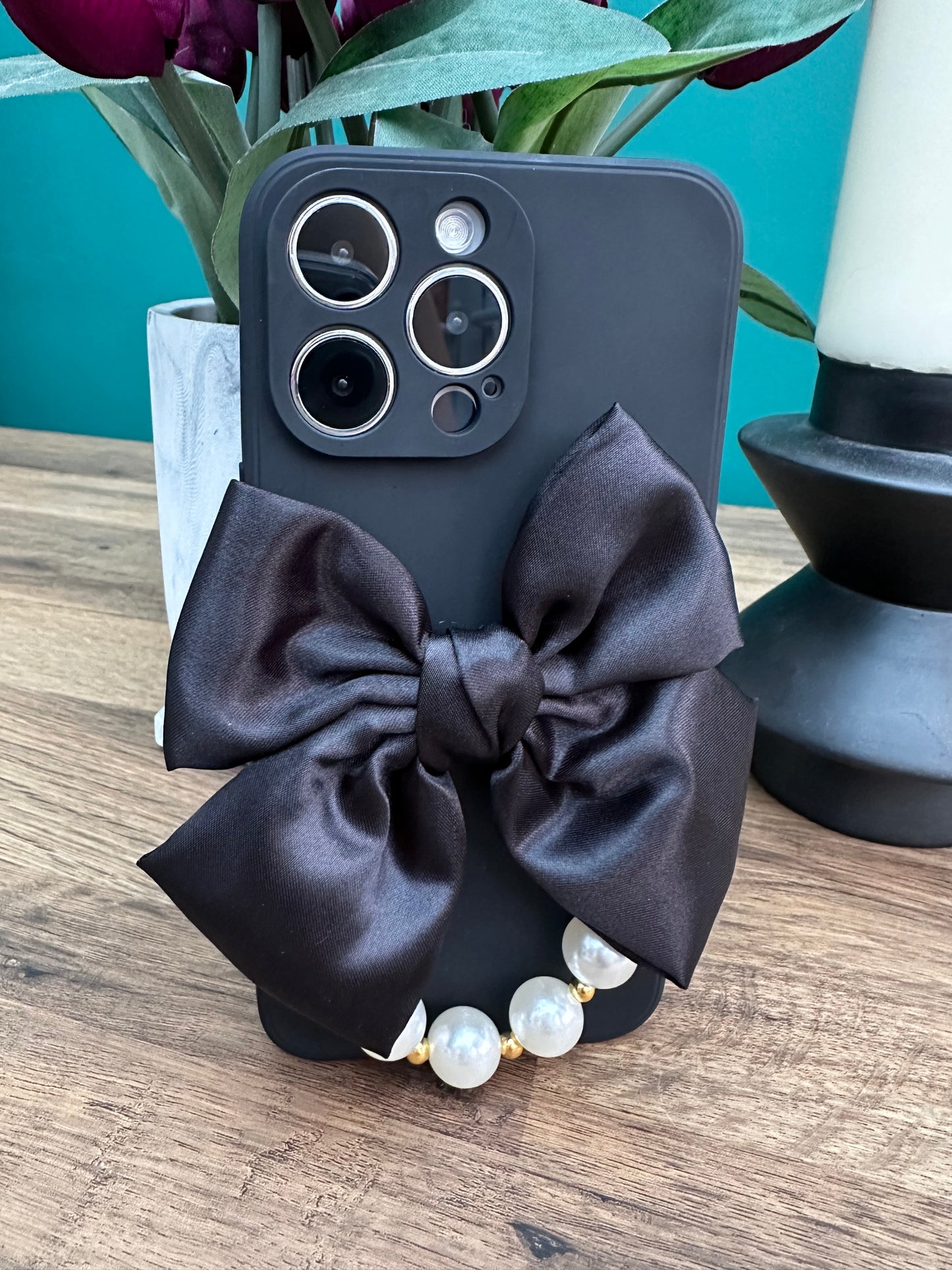 Bowtique Black Phone Case with Pearl Hand Strap