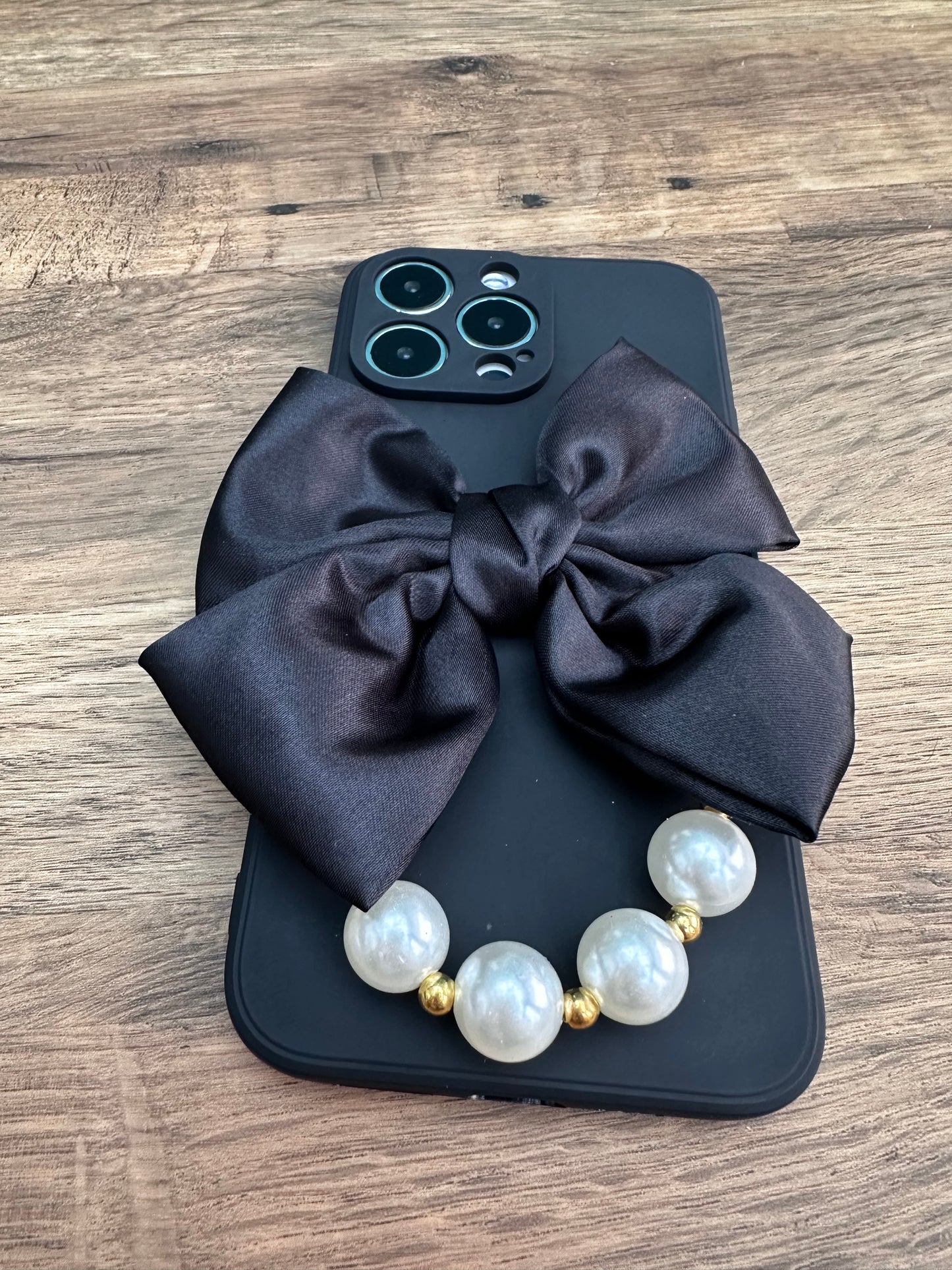 Bowtique Black Phone Case with Pearl Hand Strap