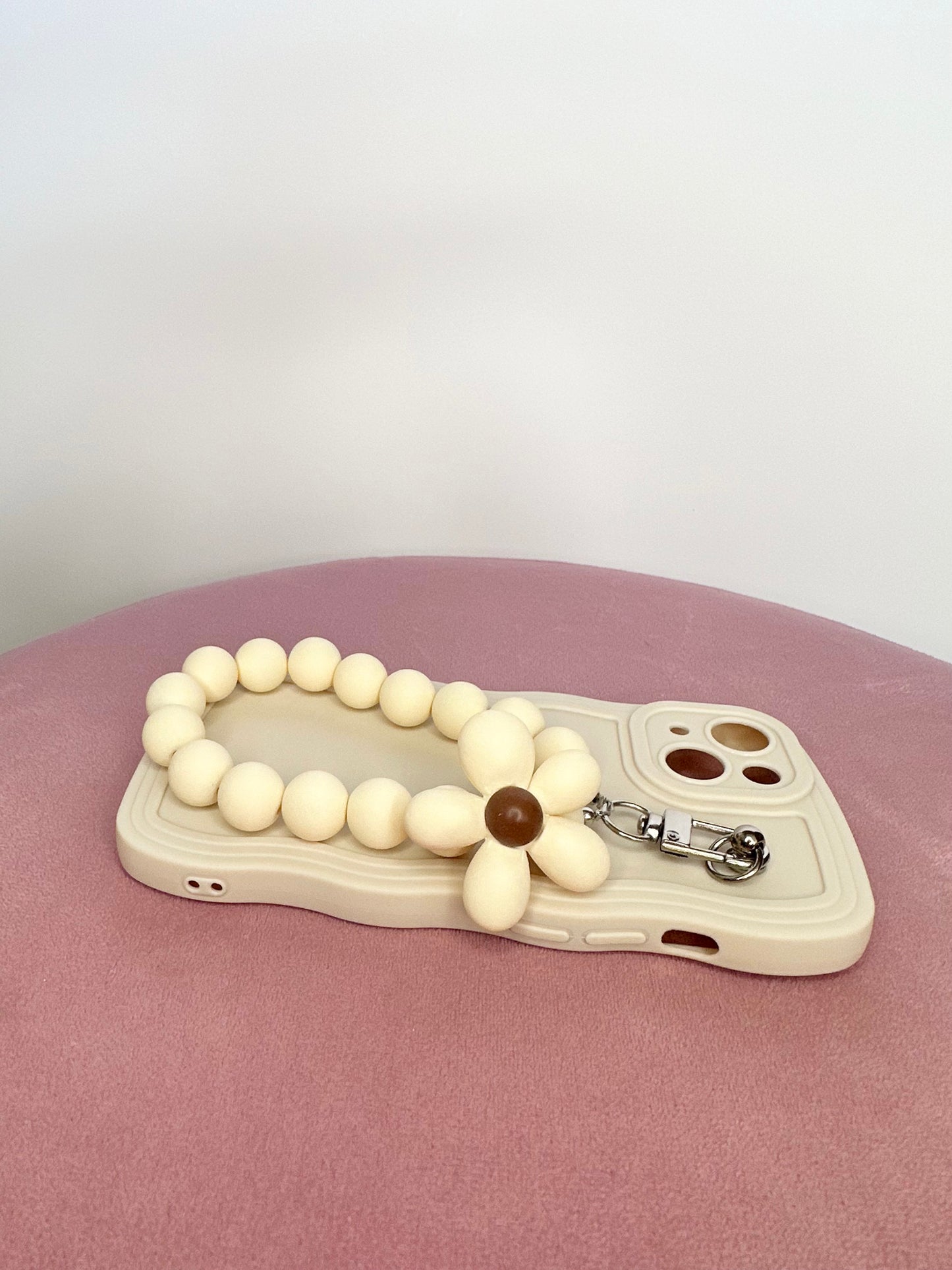 Wavy Edge Flower Pendant Cream Phone Case featuring a Chic Wrist Strap
