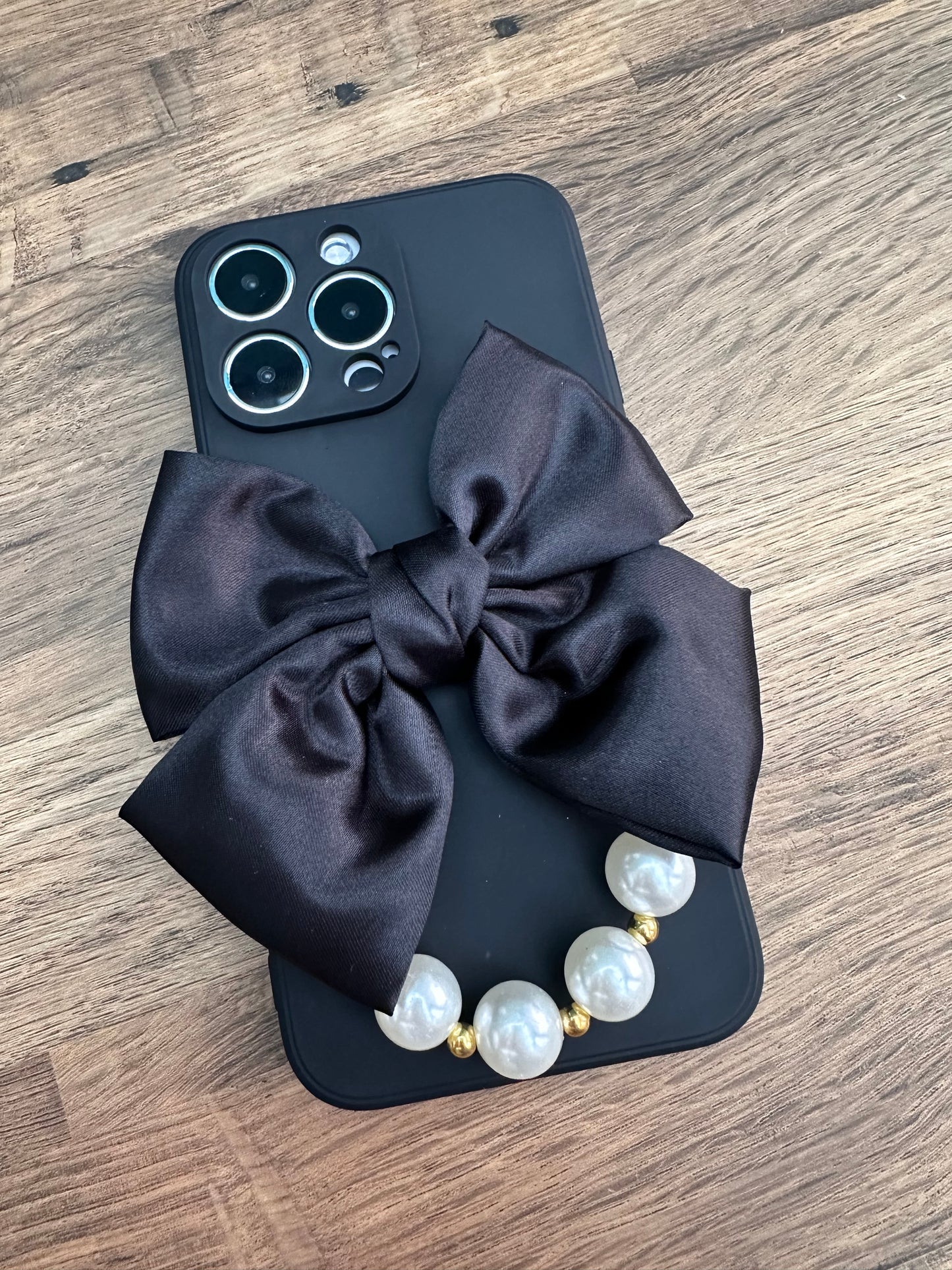 Bowtique Black Phone Case with Pearl Hand Strap