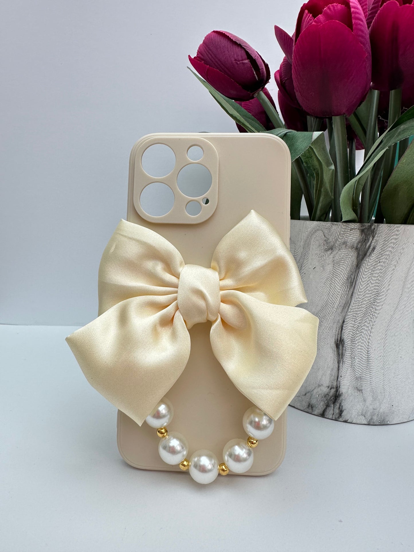 Bowtique Cream Phone Case with Pearl Hand Strap