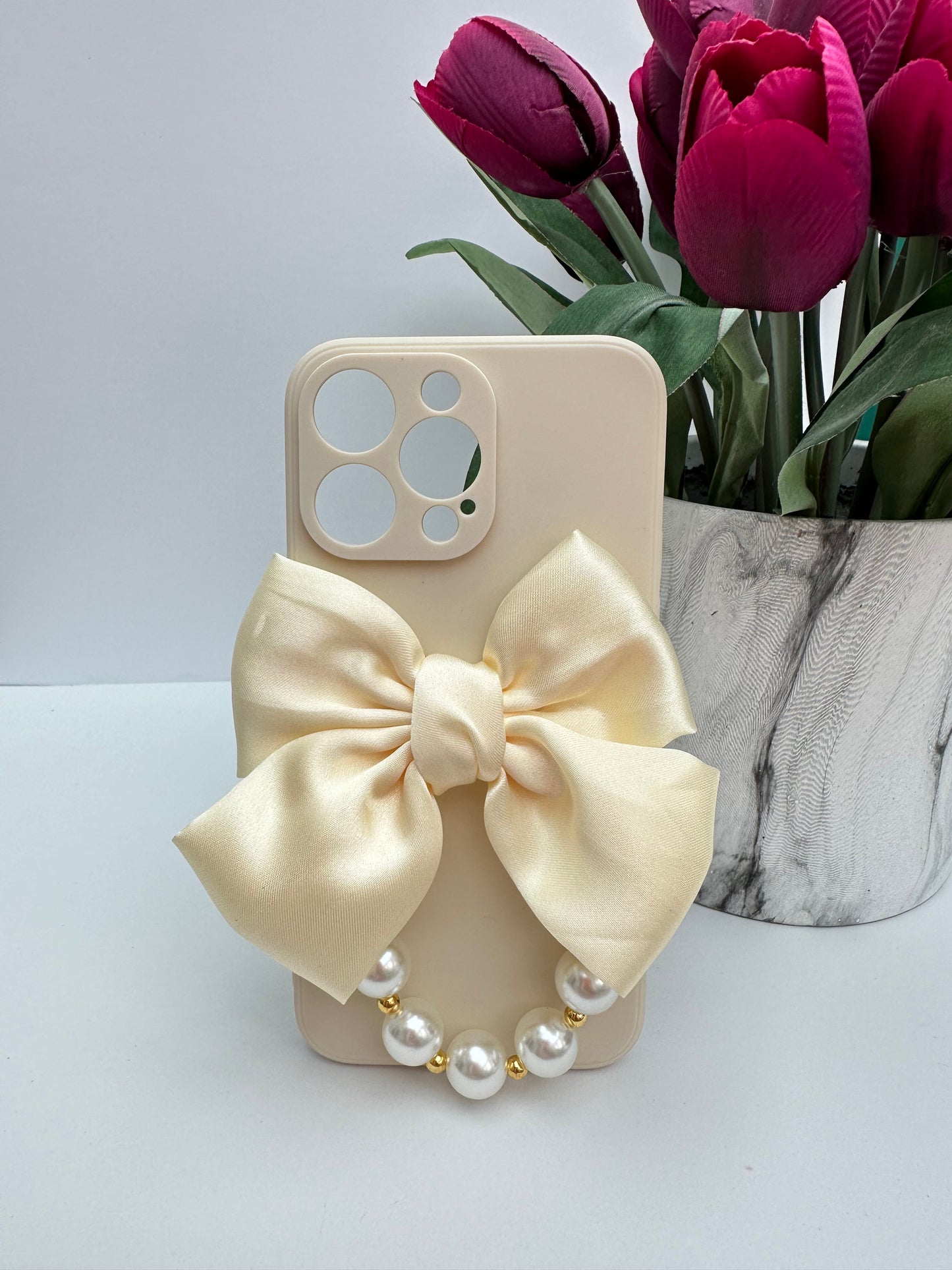 Bowtique Cream Phone Case with Pearl Hand Strap